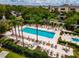Community pool with surrounding lounge chairs at 1350 Centre Court Ridge # 103, Reunion, FL 34747