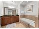 Primary bathroom with soaking tub and double vanity at 1350 Centre Court Ridge # 103, Reunion, FL 34747