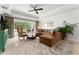 Relaxing living room featuring a sectional sofa and large windows at 1350 Centre Court Ridge # 103, Reunion, FL 34747