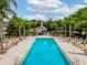 Resort-style pool with lounge chairs and a cabana at 1350 Centre Court Ridge # 103, Reunion, FL 34747