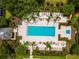 Aerial view of community pool with lounge chairs at 1350 Centre Court Ridge # 103, Reunion, FL 34747