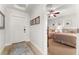 Guest bedroom with a queen-size bed and access to hallway at 1350 Centre Court Ridge # 103, Reunion, FL 34747