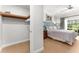 Bedroom with a queen bed and walk-in closet at 1350 Centre Court Ridge # 103, Reunion, FL 34747