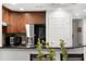 Modern kitchen with stainless steel appliances and granite countertops at 1350 Centre Court Ridge # 103, Reunion, FL 34747