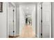 Long hallway with neutral-toned walls and tile flooring at 1350 Centre Court Ridge # 103, Reunion, FL 34747