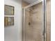 Modern shower with glass enclosure and neutral tile at 1350 Centre Court Ridge # 103, Reunion, FL 34747