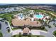 Aerial view of community with resort-style pool and clubhouse at 1568 Plunker Dr, Davenport, FL 33896