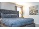 Bright bedroom with large bed and neutral color scheme at 1568 Plunker Dr, Davenport, FL 33896