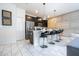 Modern kitchen with dark cabinets and an island at 1568 Plunker Dr, Davenport, FL 33896