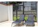 Two lounge chairs in a screened pool area at 1568 Plunker Dr, Davenport, FL 33896
