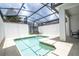 Screened-in pool with lounge chairs and patio at 1568 Plunker Dr, Davenport, FL 33896