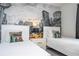 Two twin beds in a bedroom with a New York City mural at 1568 Plunker Dr, Davenport, FL 33896