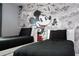 Two twin beds in a bedroom with a Mickey Mouse mural at 1568 Plunker Dr, Davenport, FL 33896