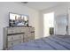 Bedroom with a large dresser and ensuite bathroom at 1568 Plunker Dr, Davenport, FL 33896