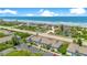 Aerial view of community near the beach, with tennis courts and ocean access at 4407 Sea Mist Ct # 267, New Smyrna Beach, FL 32169
