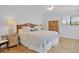 Spacious main bedroom with a king-size bed and private access to balcony at 4407 Sea Mist Ct # 267, New Smyrna Beach, FL 32169