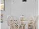Close up of a white dining table with four chairs at 4407 Sea Mist Ct # 267, New Smyrna Beach, FL 32169