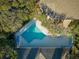 Community swimming pool with surrounding lounge chairs at 4407 Sea Mist Ct # 267, New Smyrna Beach, FL 32169