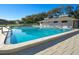 Inviting community pool with lounge chairs and patio area at 4407 Sea Mist Ct # 267, New Smyrna Beach, FL 32169