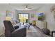 Relaxing living room featuring comfortable seating and large TV at 4407 Sea Mist Ct # 267, New Smyrna Beach, FL 32169