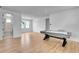 Game room with air hockey table and hardwood floors at 7540 Estuary Lake Loop, Celebration, FL 34747