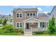 Two-story craftsman style home with front porch and landscaping at 7540 Estuary Lake Loop, Celebration, FL 34747