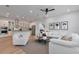 Open floor plan connecting kitchen and living room with modern furnishings at 7540 Estuary Lake Loop, Celebration, FL 34747