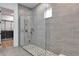 Spa-like shower with frameless glass enclosure and modern fixtures at 7540 Estuary Lake Loop, Celebration, FL 34747
