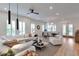 Open concept living space with large windows and light, neutral decor at 7540 Estuary Lake Loop, Celebration, FL 34747