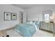 Light and airy bedroom with a serene color scheme and built-in storage at 7540 Estuary Lake Loop, Celebration, FL 34747