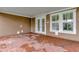Brick paved patio with double doors to home at 7540 Estuary Lake Loop, Celebration, FL 34747