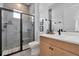 Modern bathroom with a walk-in shower and light wood vanity at 7540 Estuary Lake Loop, Celebration, FL 34747