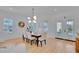 Spacious dining area with a large table, six chairs, and access to a patio at 7540 Estuary Lake Loop, Celebration, FL 34747