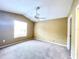 Bright and airy bedroom with a ceiling fan and window at 837 Grand Regency Pt # 207, Altamonte Springs, FL 32714