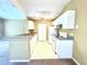 Efficient kitchen featuring white appliances and ample cabinetry at 837 Grand Regency Pt # 207, Altamonte Springs, FL 32714