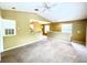 Spacious living room with vaulted ceiling and carpeting at 837 Grand Regency Pt # 207, Altamonte Springs, FL 32714