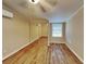 Bright bedroom with mirrored closet and wood-look floors at 424 E Welch Rd, Apopka, FL 32712