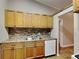 Bright kitchen features ample cabinetry and a tile backsplash at 424 E Welch Rd, Apopka, FL 32712