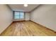 Spacious living area featuring wood-look floors and a window at 424 E Welch Rd, Apopka, FL 32712