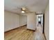 Large bedroom with mirrored closet doors and ceiling fan at 424 E Welch Rd, Apopka, FL 32712