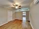 Spacious living room with wood-look floors and ceiling fan at 424 E Welch Rd, Apopka, FL 32712