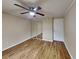 Bedroom with mirrored closet doors and ceiling fan at 424 E Welch Rd, Apopka, FL 32712