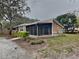 Cute ranch home with screened porch and mature landscaping at 424 E Welch Rd, Apopka, FL 32712