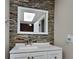 Modern bathroom with stone-look tile and white vanity at 424 E Welch Rd, Apopka, FL 32712