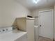 Functional laundry room with washer, dryer, and storage at 424 E Welch Rd, Apopka, FL 32712