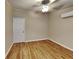 Spacious bedroom with wood-look floors and ceiling fan at 424 E Welch Rd, Apopka, FL 32712
