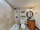 Clean bathroom with tile shower, vanity with sink, and toilet at 424 E Welch Rd, Apopka, FL 32712
