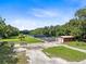 Overview of property showing outbuildings and open space at 424 E Welch Rd, Apopka, FL 32712