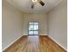 Relaxing bedroom with wood-look floors and sliding glass doors at 424 E Welch Rd, Apopka, FL 32712