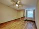 Spacious bedroom with mirrored closet and a ceiling fan at 424 E Welch Rd, Apopka, FL 32712